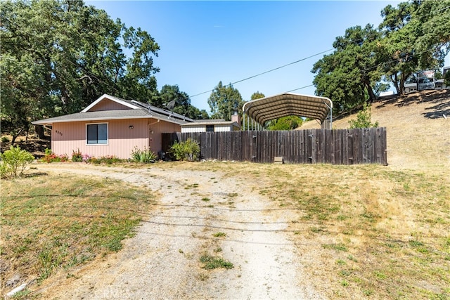 view of front of property featuring a carport