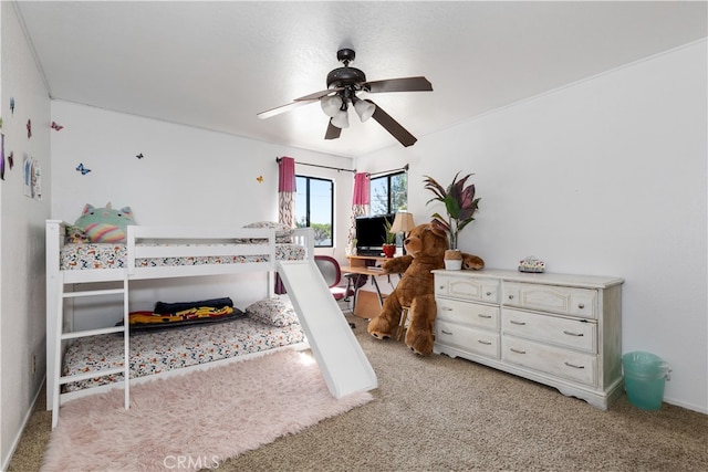 bedroom with ceiling fan and light carpet