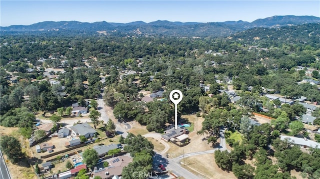 birds eye view of property featuring a mountain view