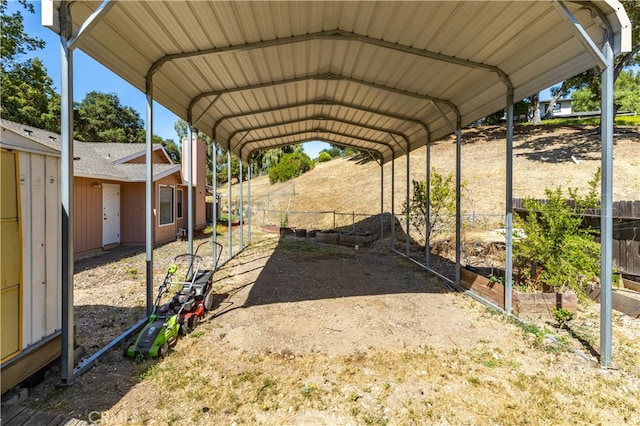 view of vehicle parking featuring a carport