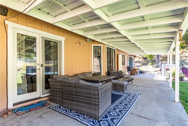 view of patio / terrace with an outdoor living space and french doors