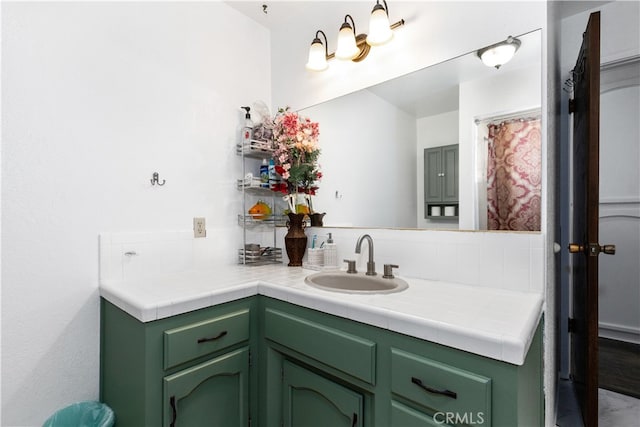 bathroom featuring tasteful backsplash and vanity