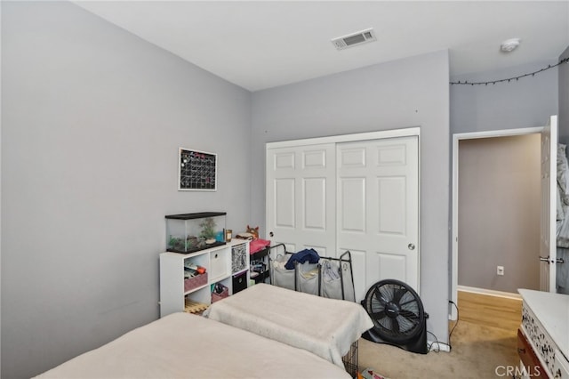 carpeted bedroom with a closet