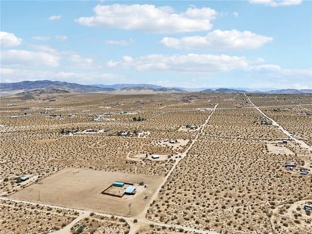 drone / aerial view featuring a mountain view