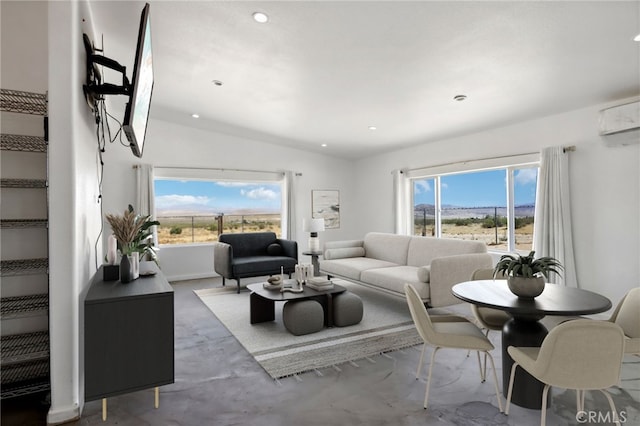 living room featuring a wealth of natural light and vaulted ceiling