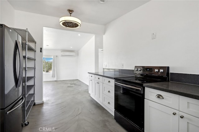 kitchen with a wall unit AC, stainless steel refrigerator, white cabinetry, and black range with electric cooktop