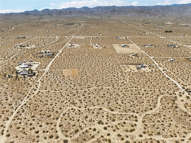 drone / aerial view featuring a mountain view