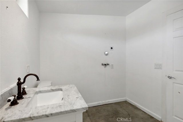 bathroom with sink and concrete floors