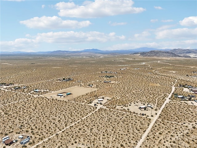 birds eye view of property featuring a mountain view