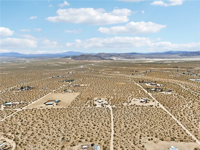 drone / aerial view featuring a mountain view