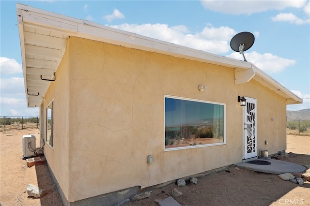 view of property exterior with cooling unit