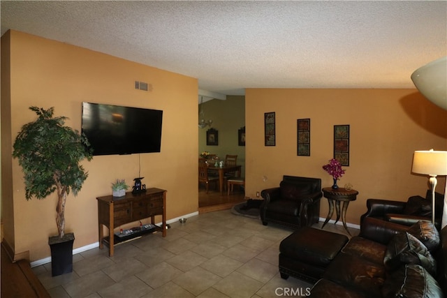 tiled living room featuring a textured ceiling and lofted ceiling