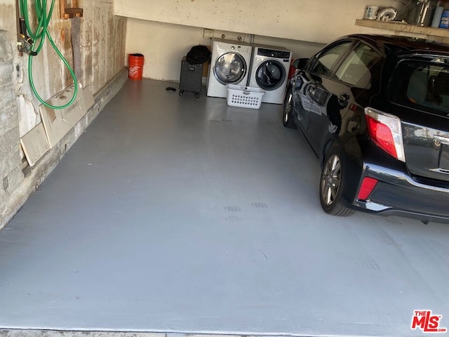 garage with separate washer and dryer