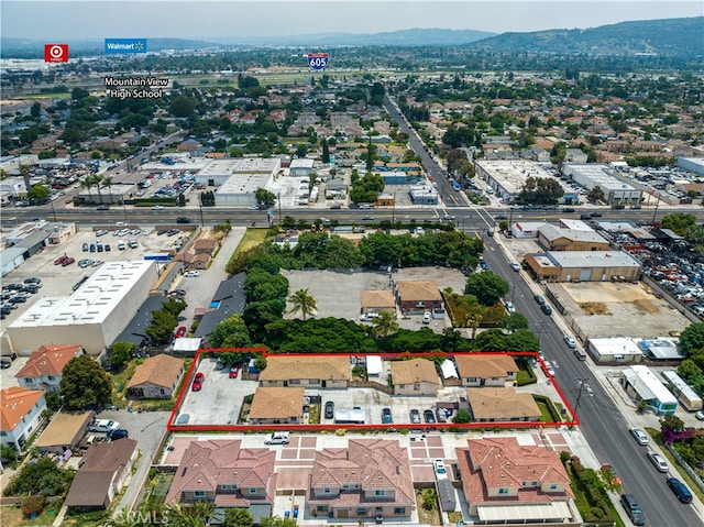 birds eye view of property with a mountain view