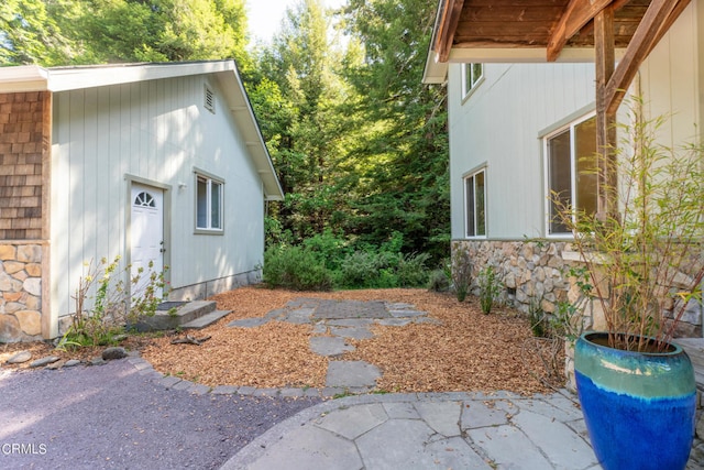 view of side of home with a patio