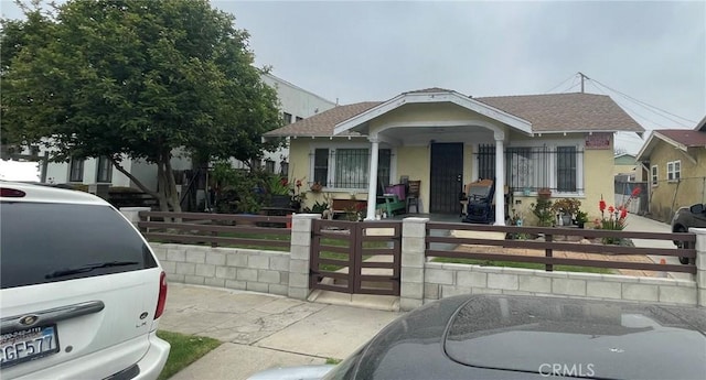 bungalow-style home featuring covered porch