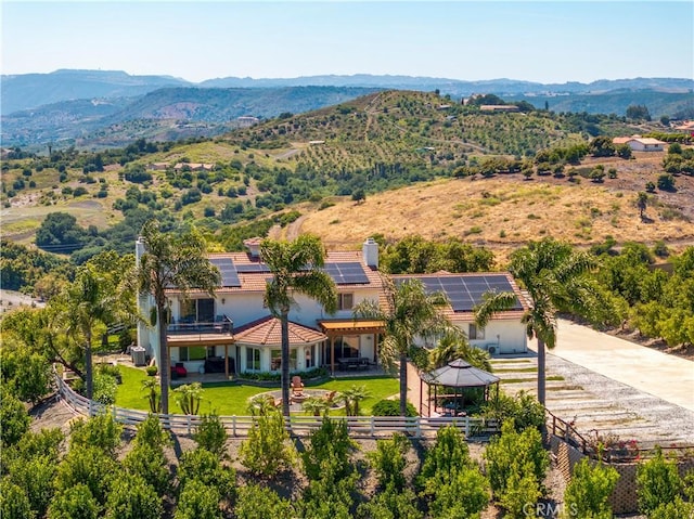 drone / aerial view featuring a mountain view