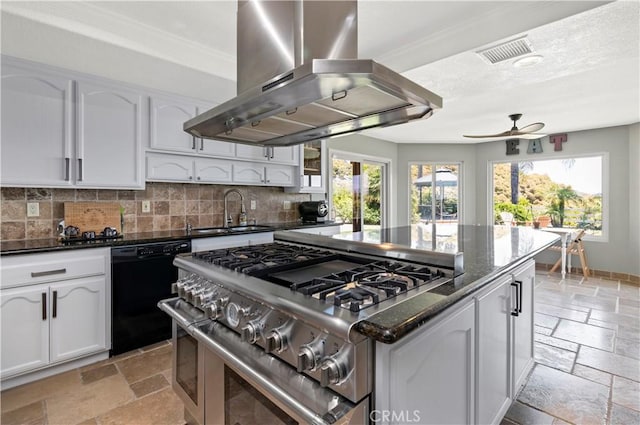 kitchen featuring dishwasher, sink, tasteful backsplash, island range hood, and high end stainless steel range