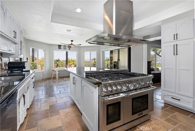 kitchen featuring dishwasher, range with two ovens, ceiling fan, white cabinetry, and island exhaust hood