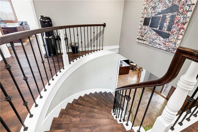 stairs with hardwood / wood-style flooring