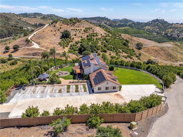 birds eye view of property featuring a mountain view