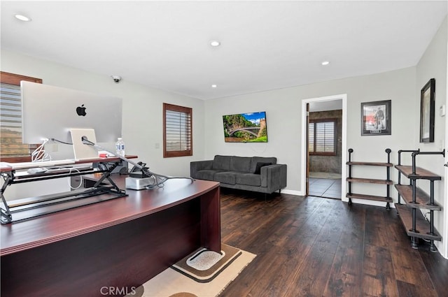 home office with dark hardwood / wood-style floors