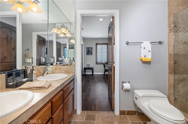 bathroom featuring toilet, vanity, and hardwood / wood-style flooring