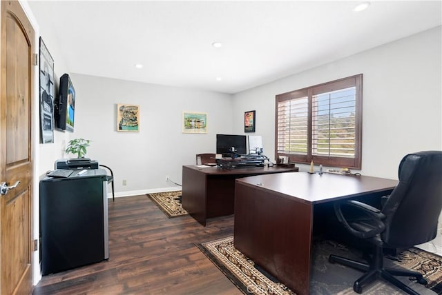 office space with dark wood-type flooring