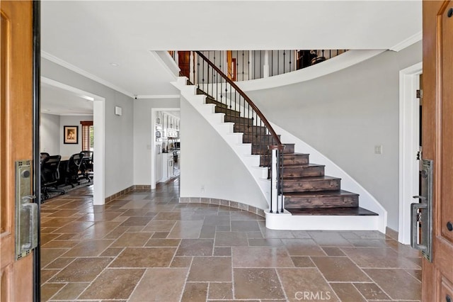 entryway featuring crown molding