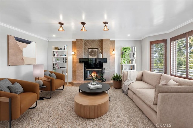 living room featuring tile walls, carpet floors, crown molding, and a tiled fireplace