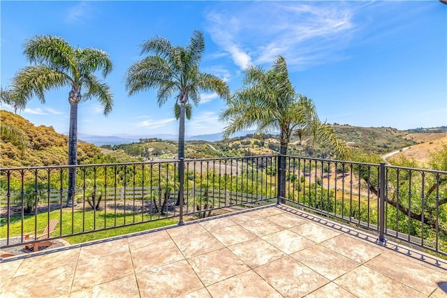 view of patio / terrace featuring a mountain view