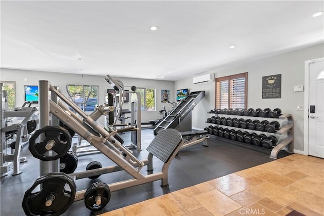 workout area with a wall mounted air conditioner