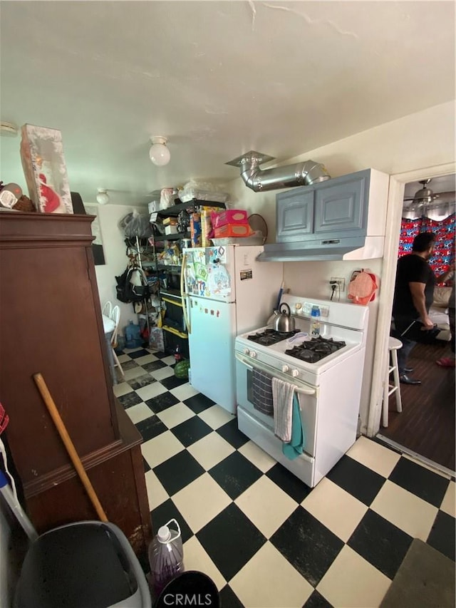 1348 E 21st St, Los Angeles, CA 90011 - kitchen with white appliances, light flooring, and under cabinet range hood