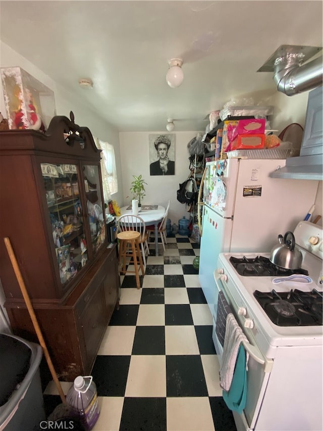 kitchen with white gas range