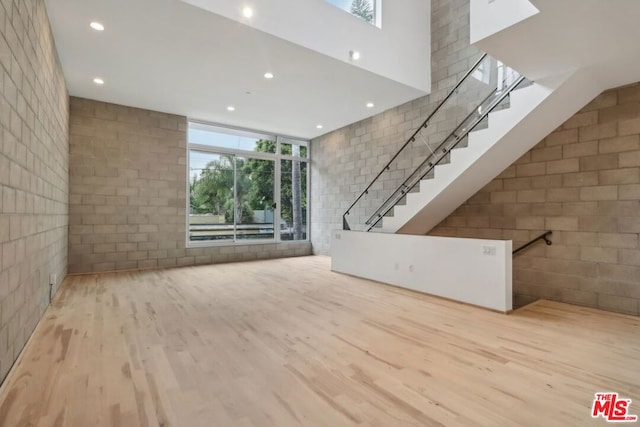 unfurnished living room featuring light hardwood / wood-style floors