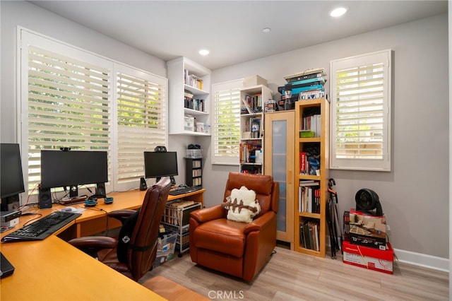 office with light hardwood / wood-style floors