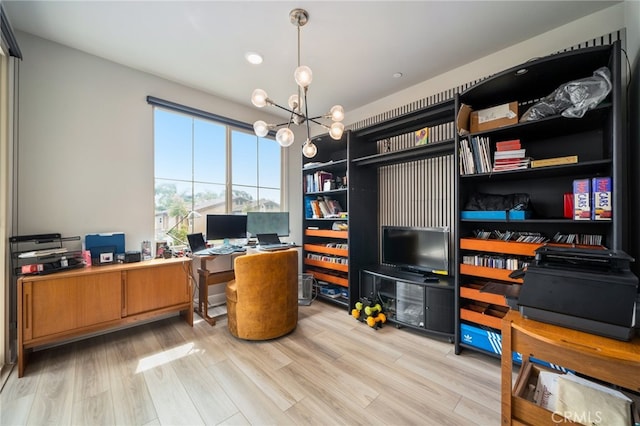 home office featuring a chandelier and light hardwood / wood-style flooring