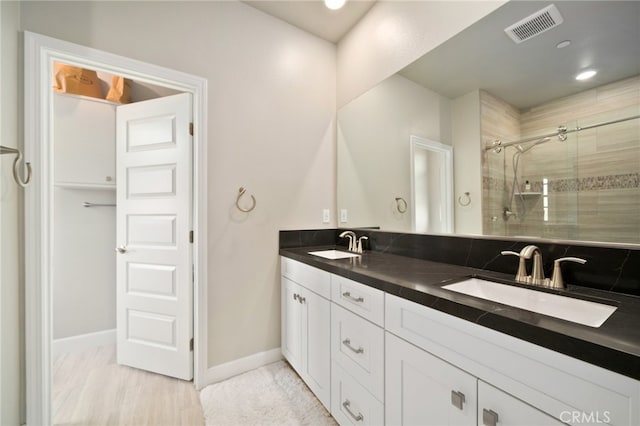 bathroom with vanity and an enclosed shower