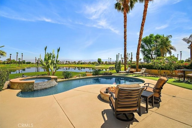 view of swimming pool featuring a patio, a fire pit, a water view, and a pool with connected hot tub