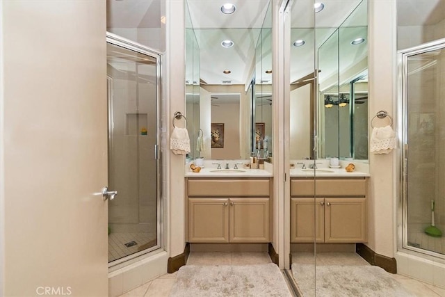 full bathroom featuring recessed lighting, a shower stall, tile patterned flooring, baseboards, and vanity