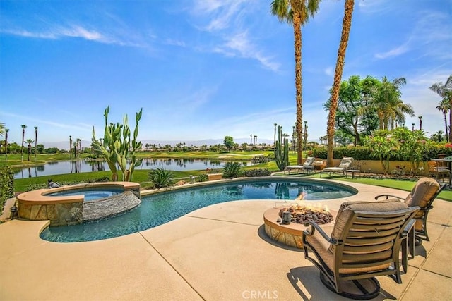 view of swimming pool with an in ground hot tub, a water view, and a patio area