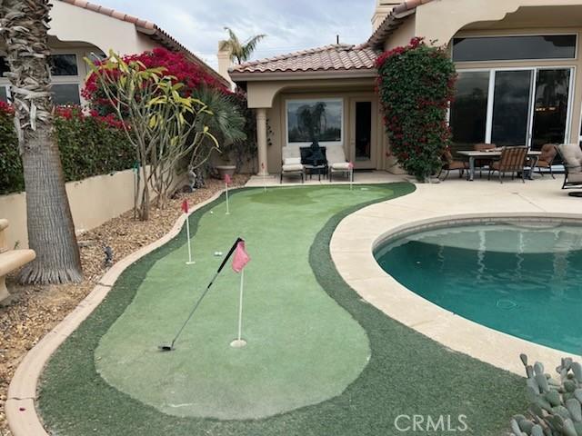 view of swimming pool featuring a patio area and a fenced in pool