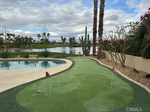 view of pool featuring a water view