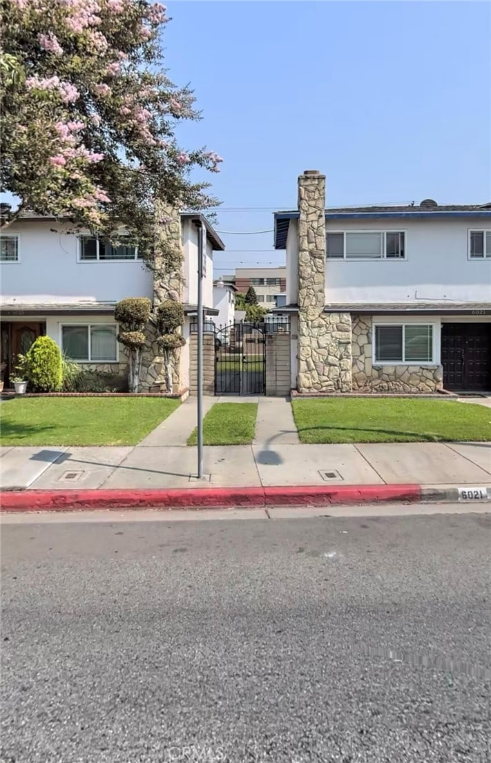 view of front facade with a front lawn and a garage