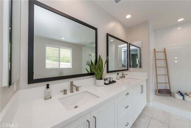 bathroom with tile patterned floors and vanity