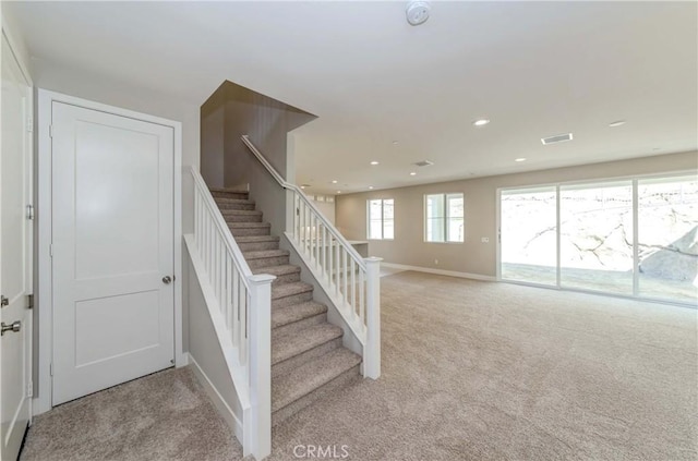 stairway with carpet floors