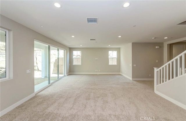 empty room featuring light carpet