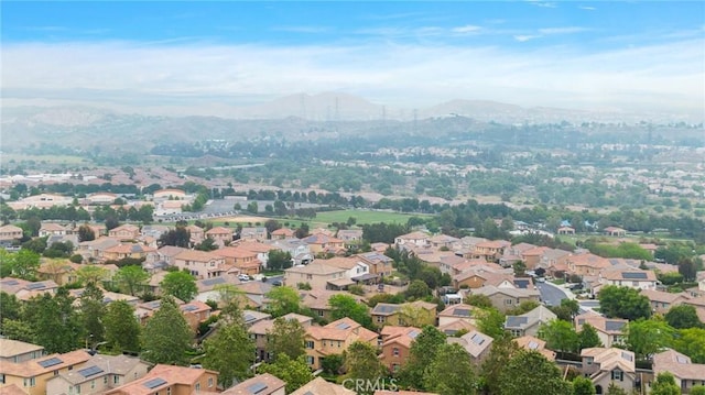 aerial view featuring a mountain view and a residential view