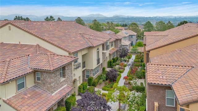 drone / aerial view with a residential view and a mountain view