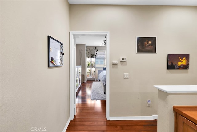 hall with dark hardwood / wood-style floors